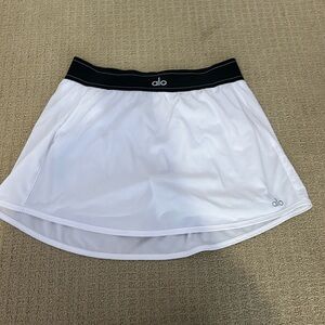 Alo Yoga Match Point Tennis Skirt, black and white, size medium.